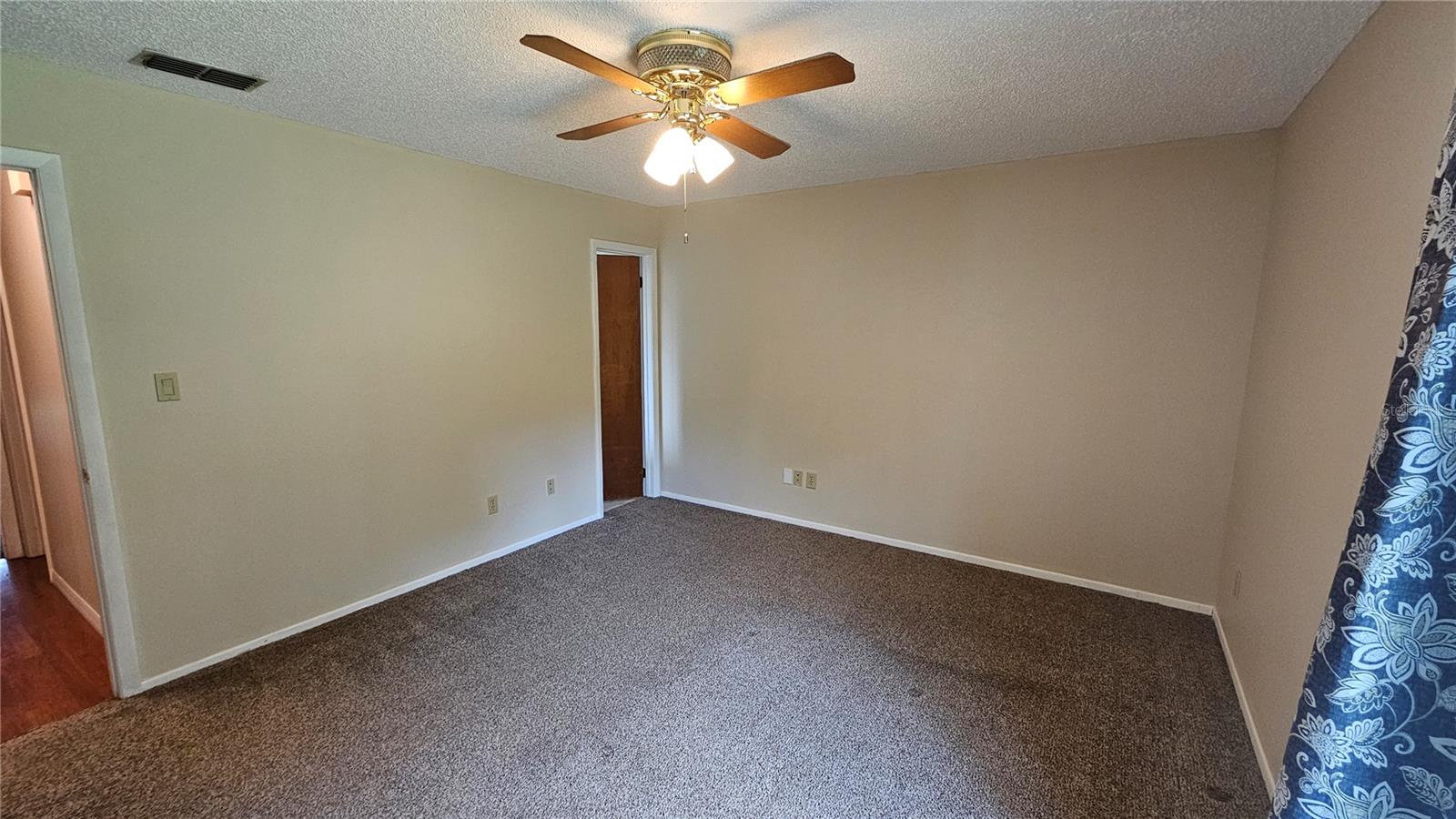 Prinary bedroom, doorway to master bath in far corner
