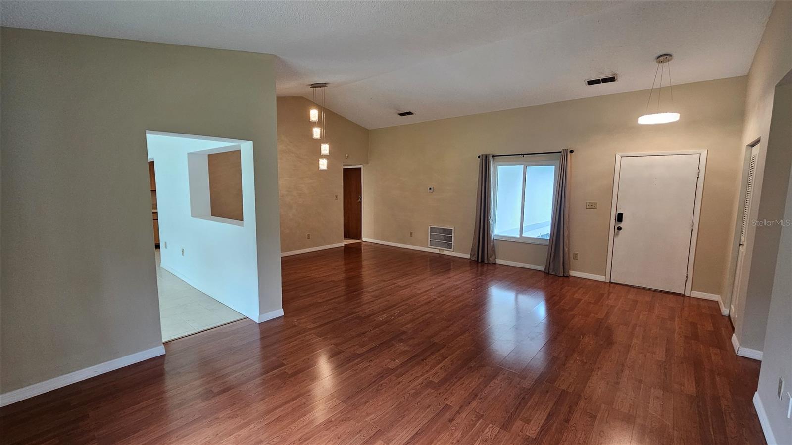 Living room with view toward dining room & kitchen