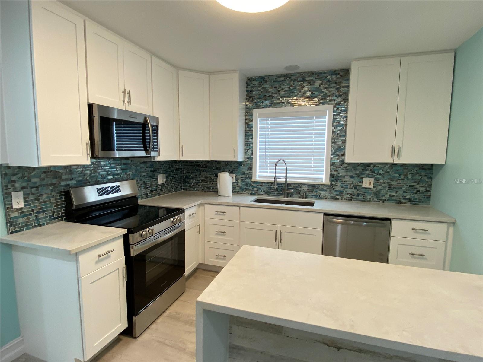 Updated kitchen with new cabinets and quartz countertops