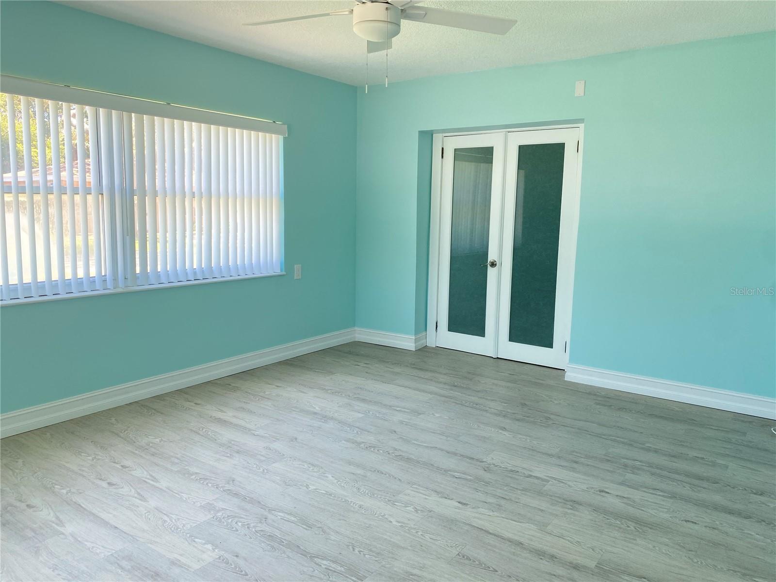 Large primary bedroom w/French doors to Ensuite Bath
