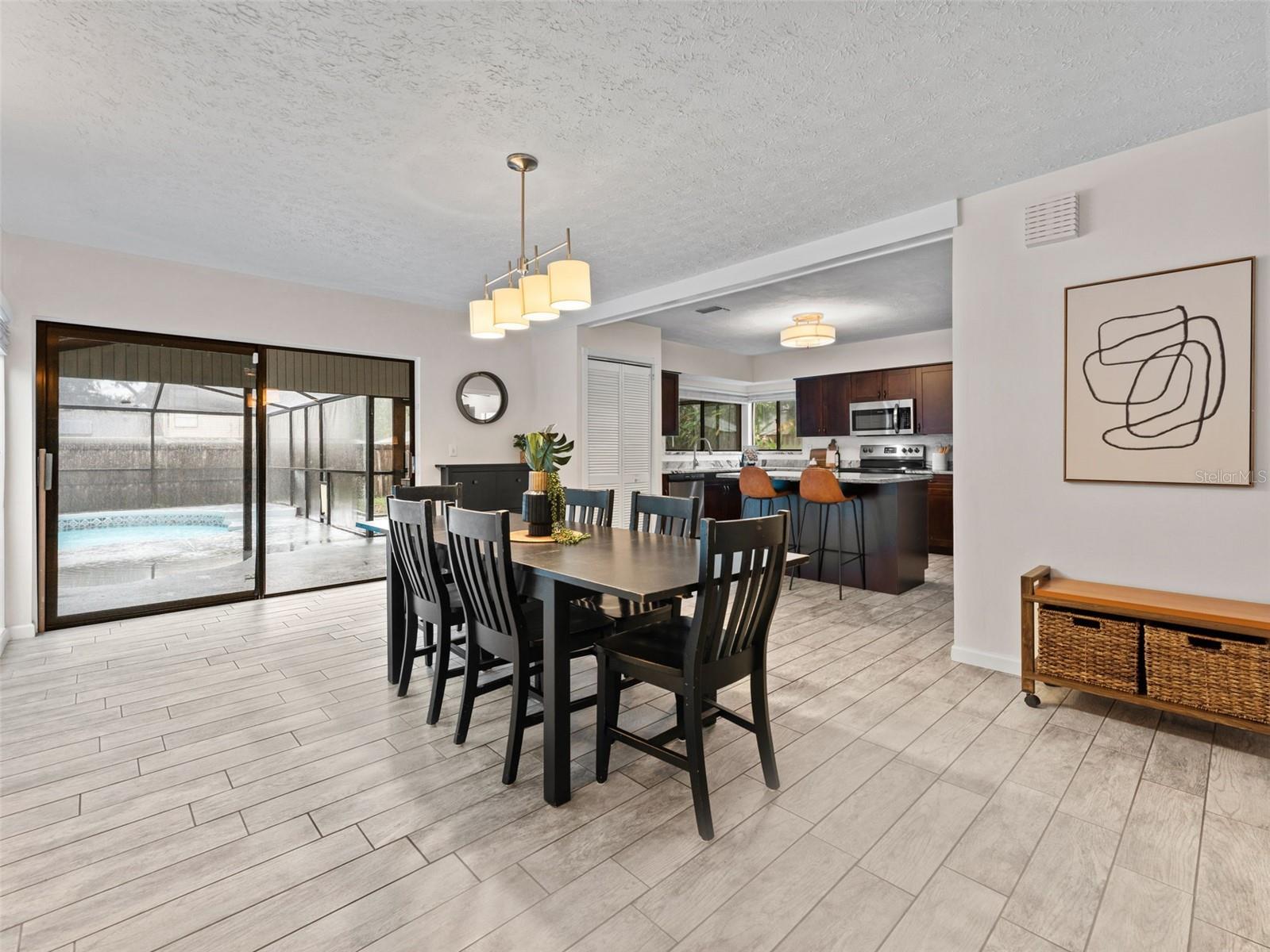 Screened pool, covered patio and expansive backyard through the sliders!