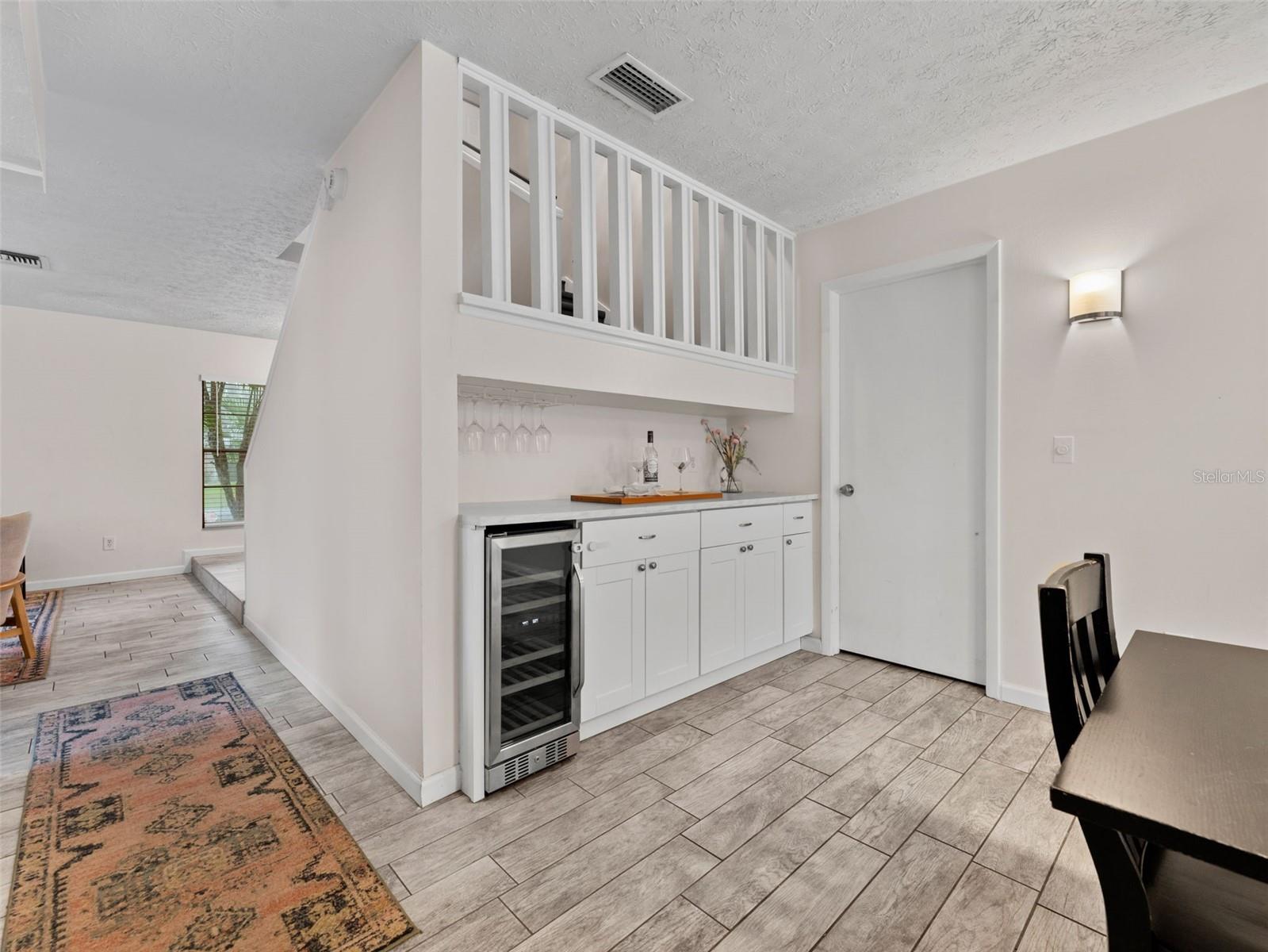 Laundry room and garage adjacent to the dining room