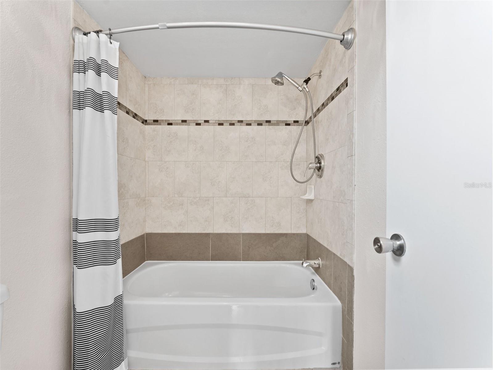 Shower/Bath combo with commode with secondary door