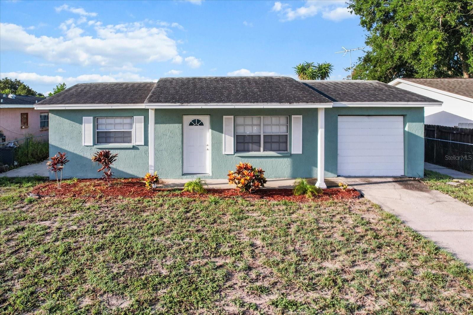 The spacious front yard is a blank canvas