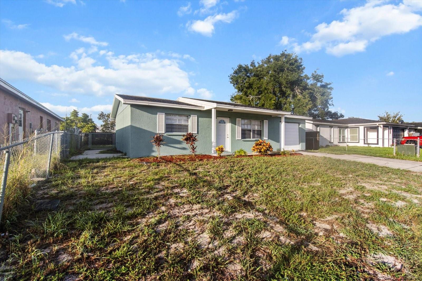 Step into a home that feels warm and welcoming, with a covered porch, and space to make it your own