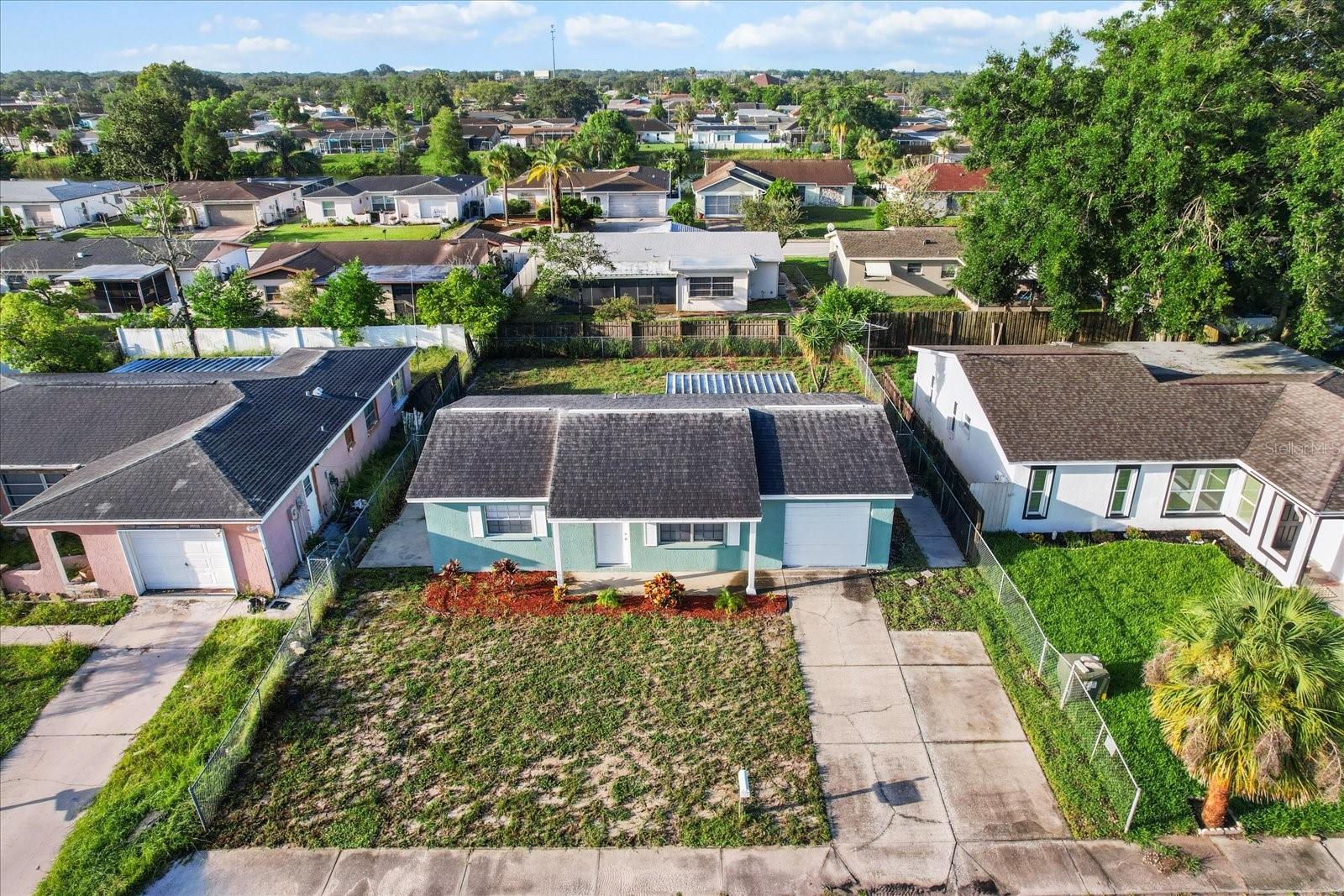 This cozy home sits on a lot with a fenced backyard in a quiet, established neighborhood