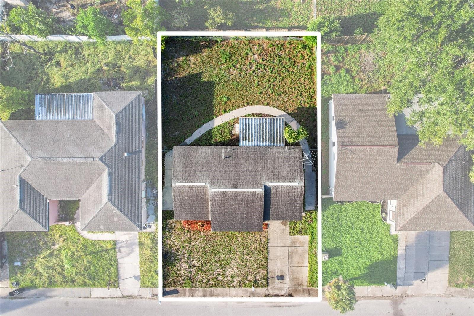 Aerial view of the home and lot lines, great layout with space in the front and back.