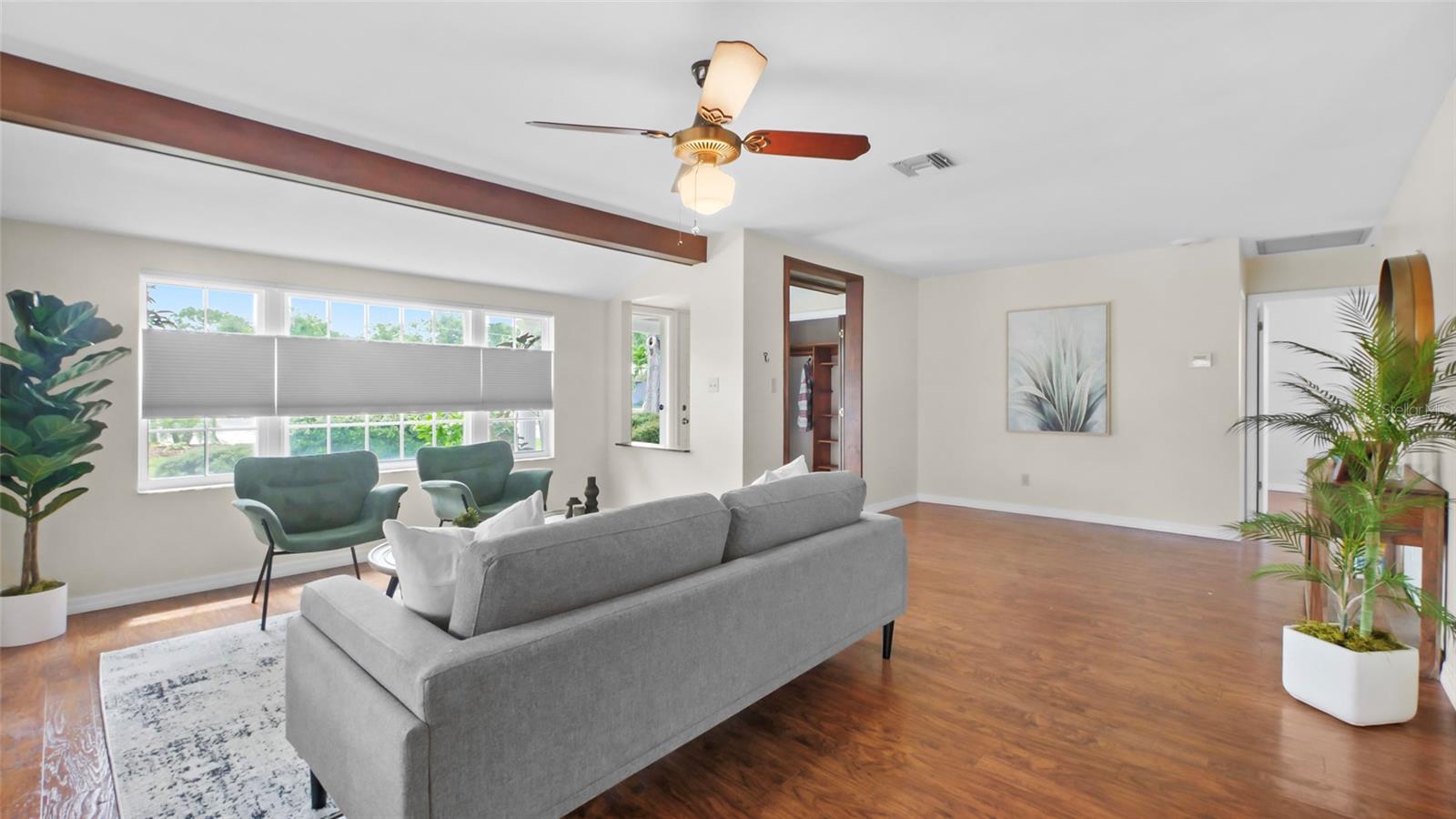 Living room with lots of natural light and wood floors