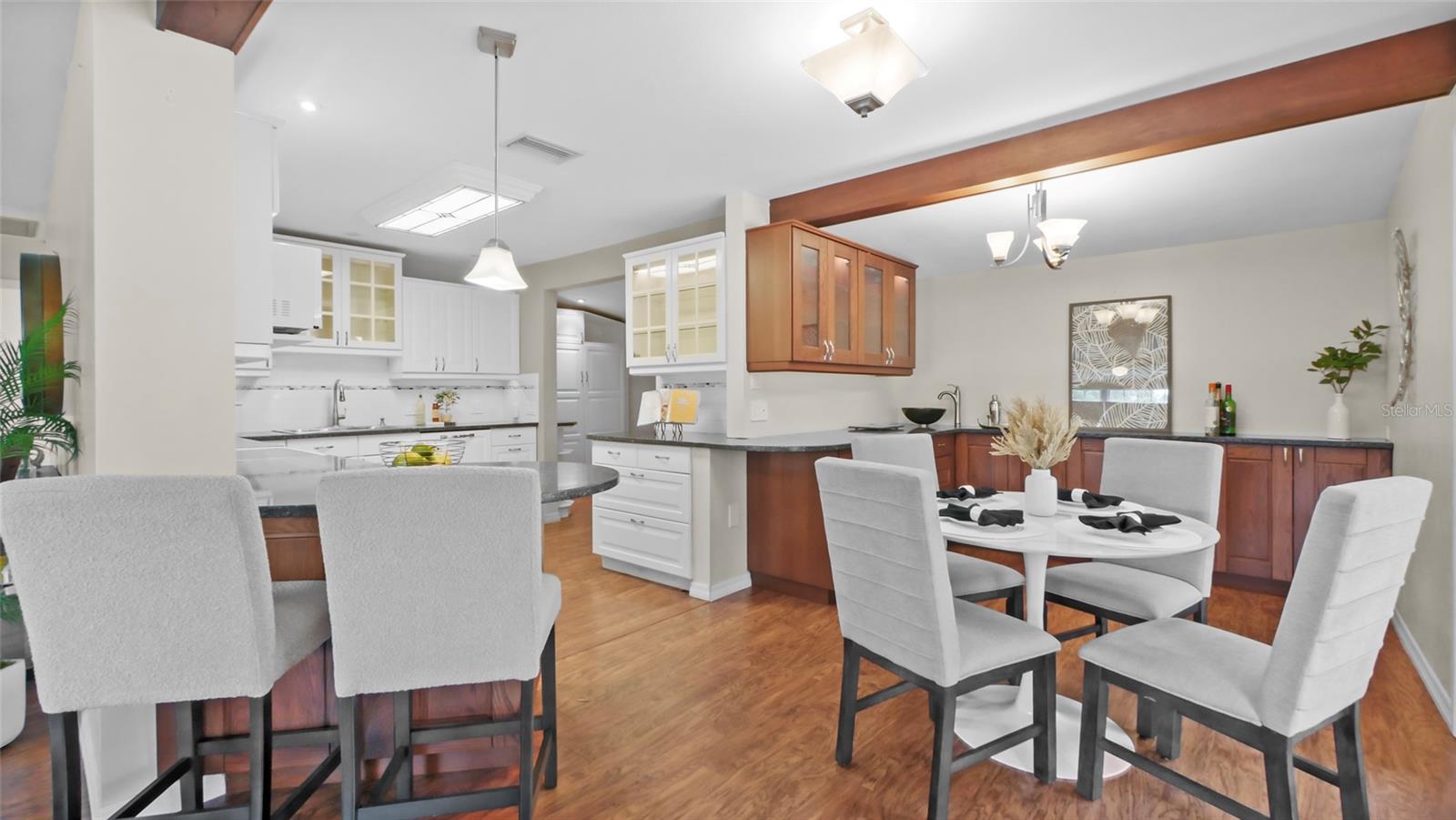 Eat-in kitchen and dining space open to living room