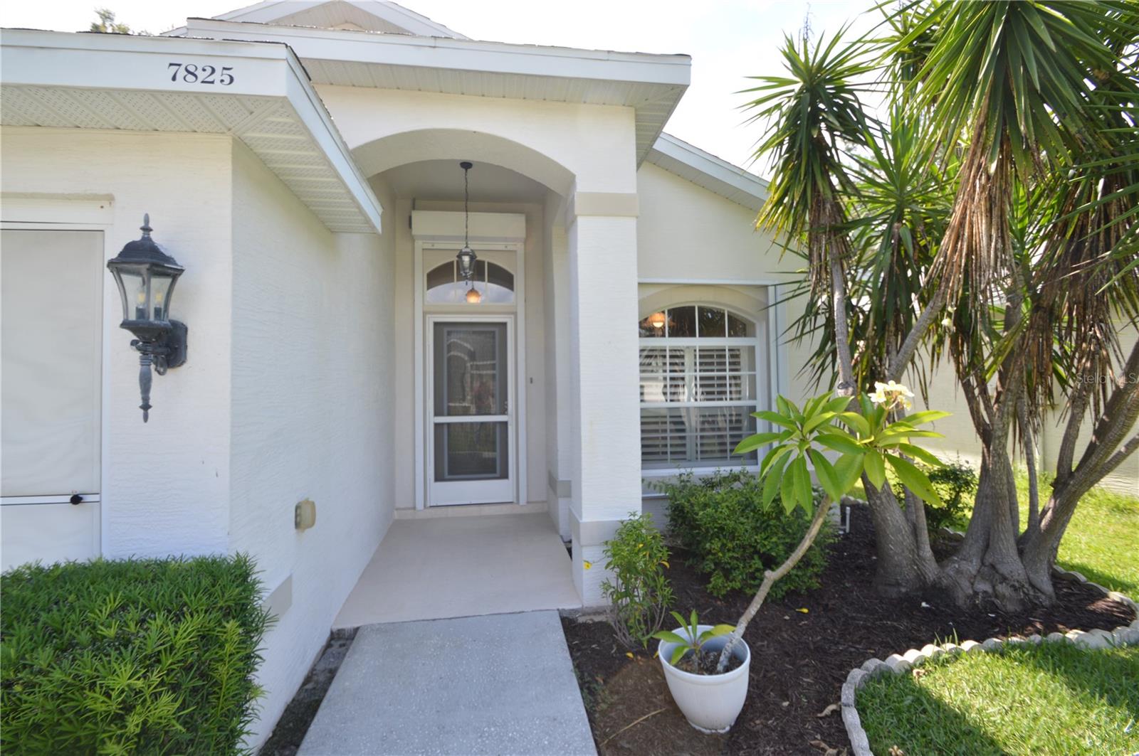 Front Door With Covered Porch & Hurricane Shutters