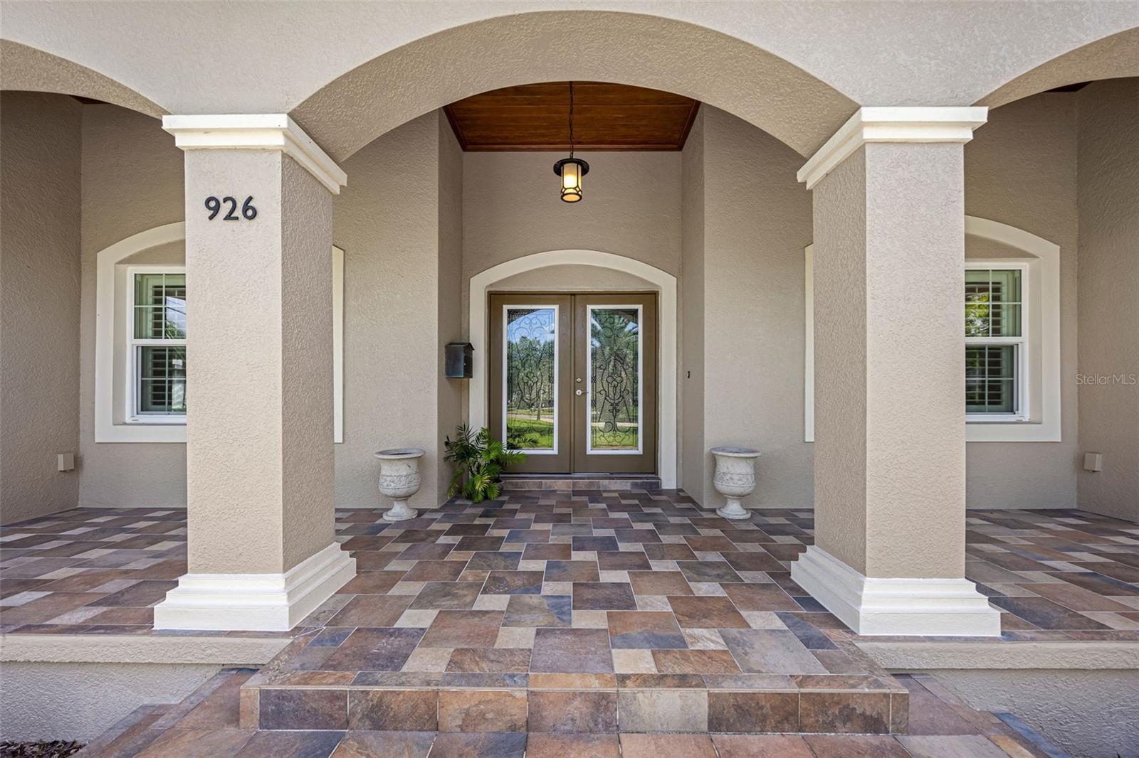 Gorgeous archway entryway with dark wood shiplap accents