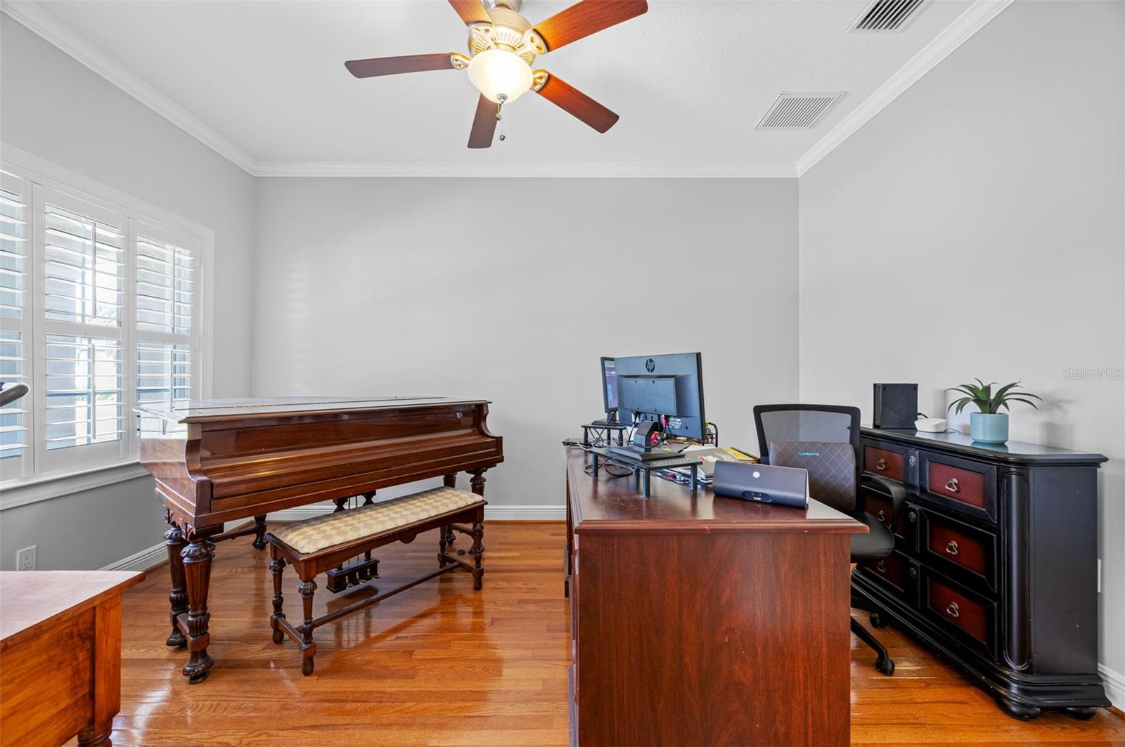 A perfect piano room or an office. Lots of space with pocket doors for privacy