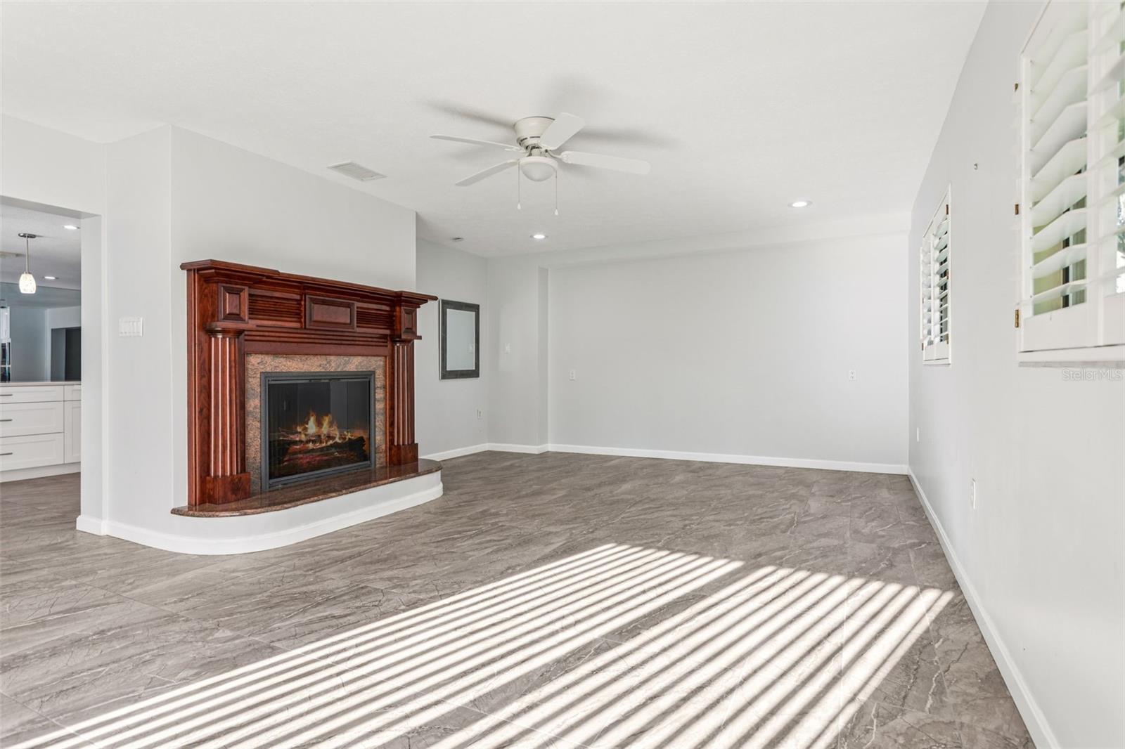 Wood burning fireplace in living room.