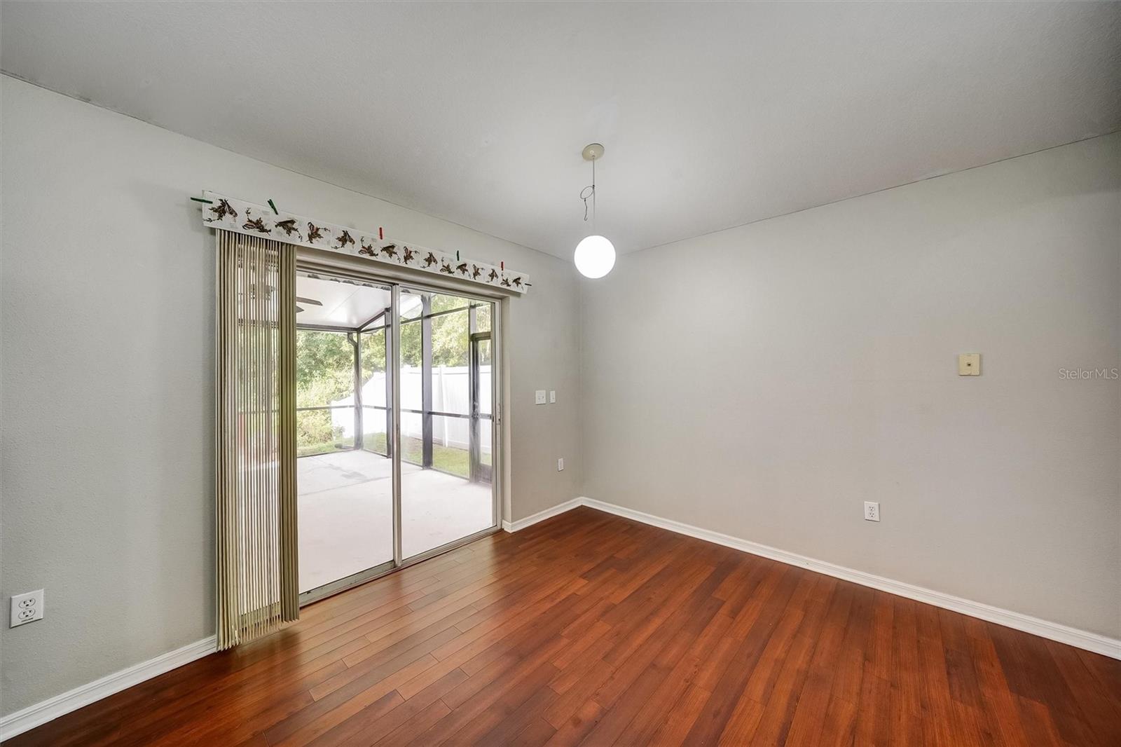 Kitchen/dinette leading to back screened lanai and deck