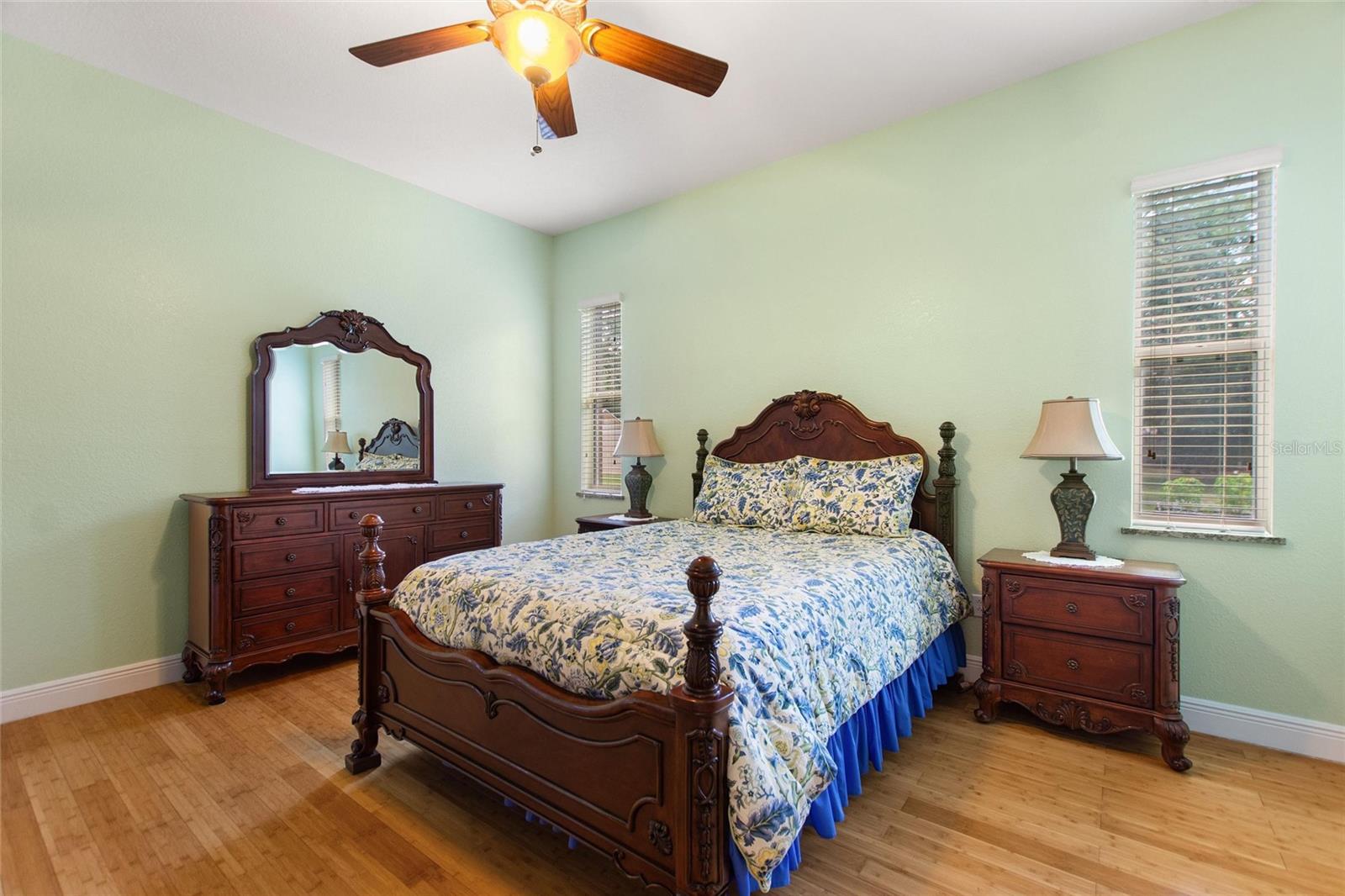 Large master bedroom with bamboo flooring and extra large walk in closet.