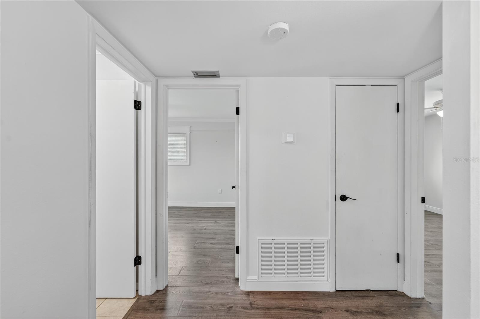 Hallway to both bedrooms & guest bathroom.