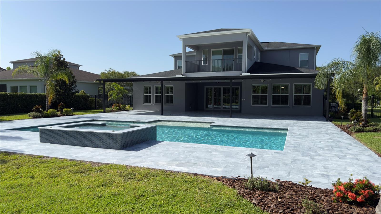Pool/spa & view of back of home