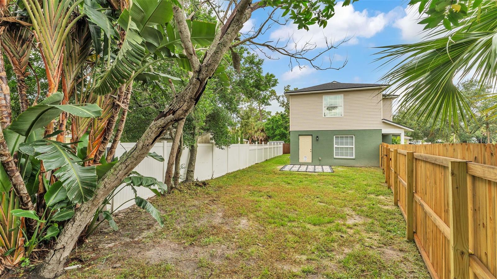Backyard with brand new wooden fence (2025)