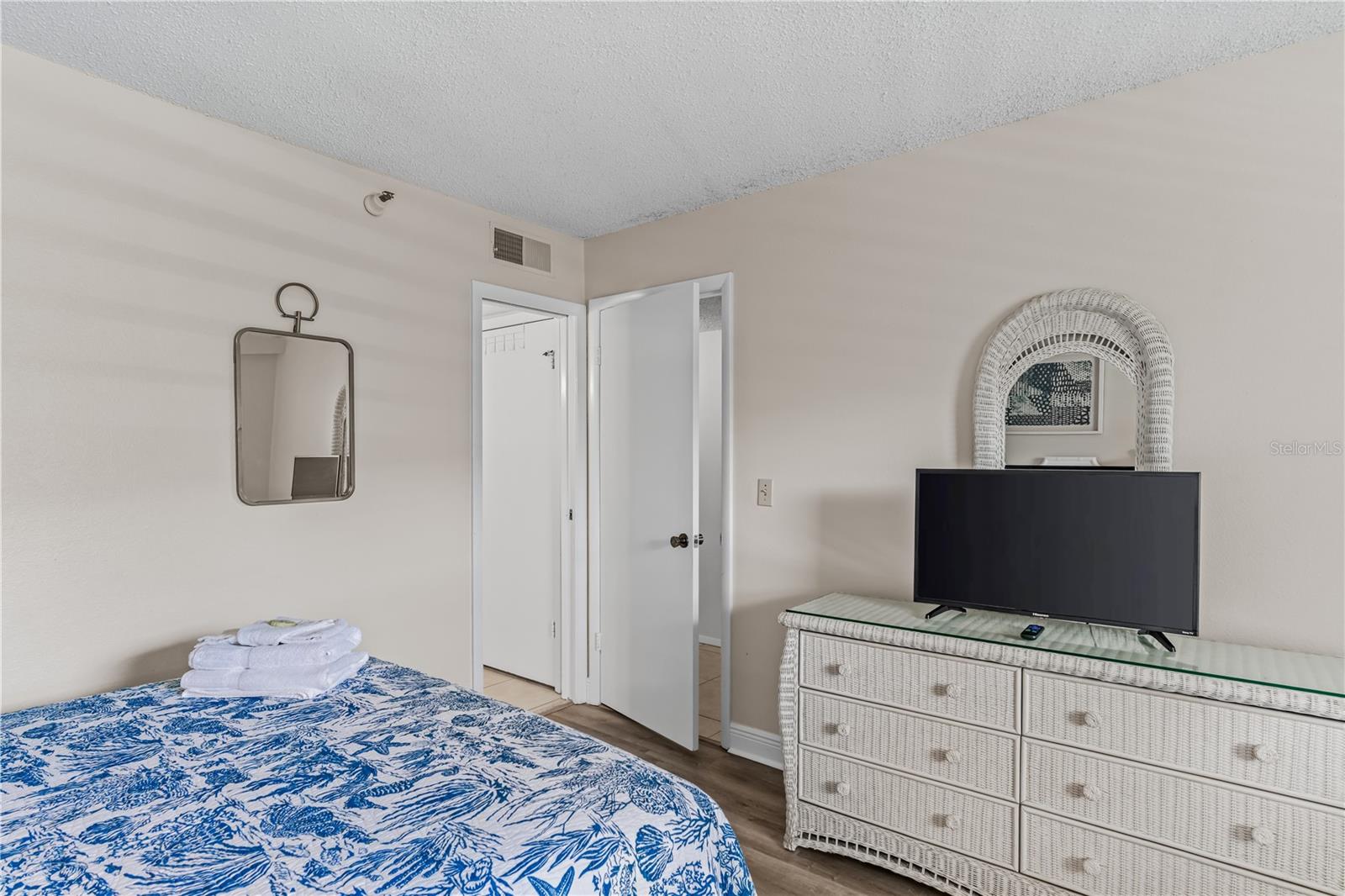 Bathroom has door from bedroom and hallway