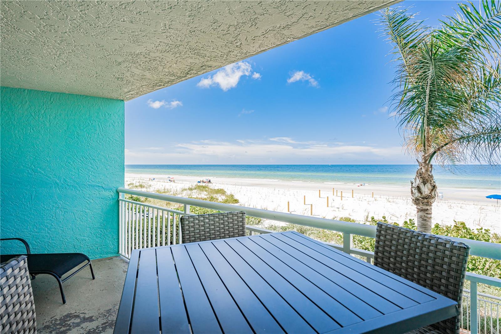 Nice balcony furniture that allows you to see over the railing to the water