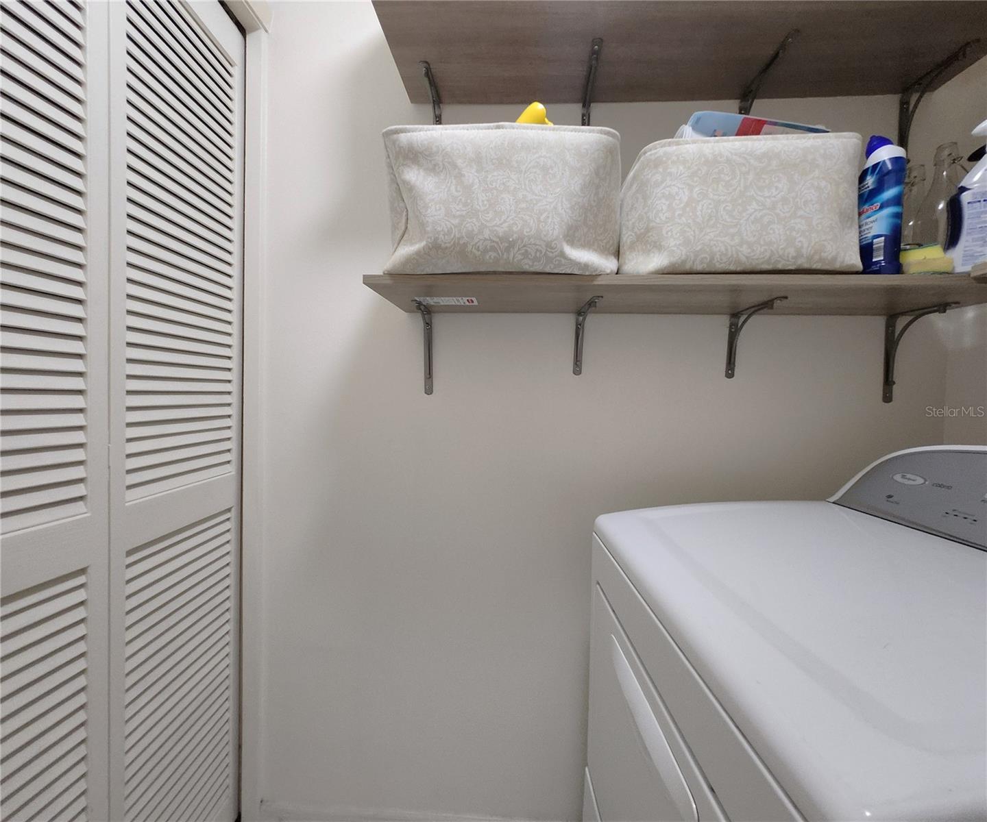 Inside Laundry Room includes a large built-in closet