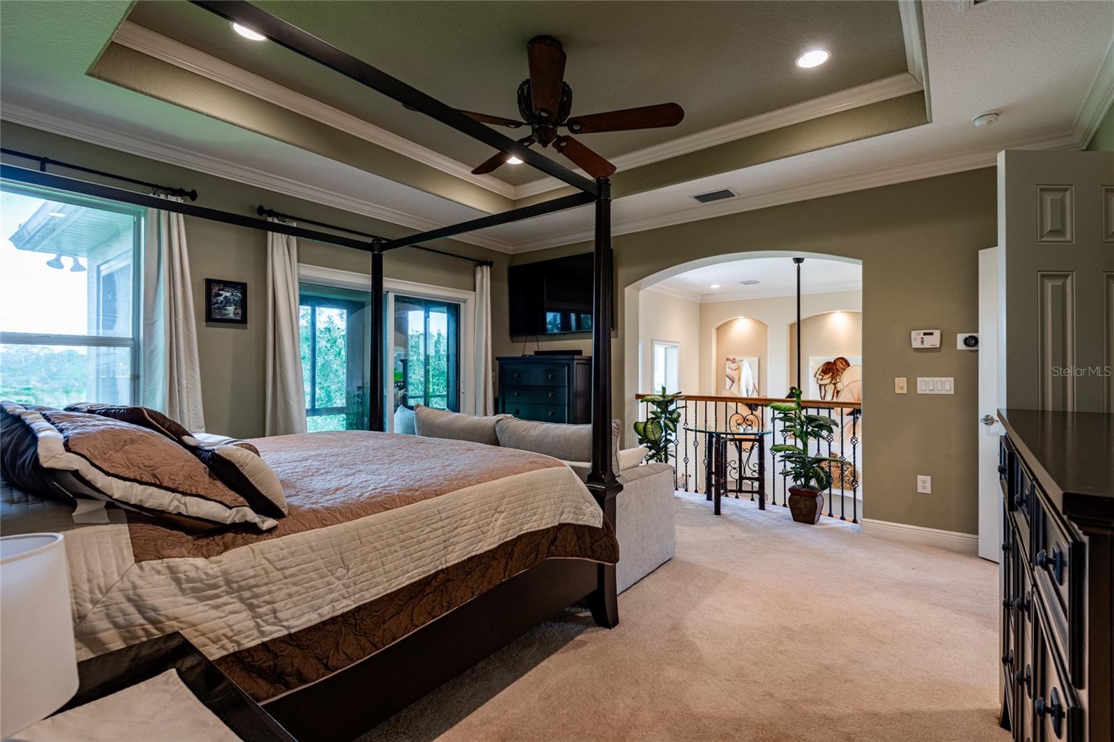 Master bedroom overlooks the living room area.