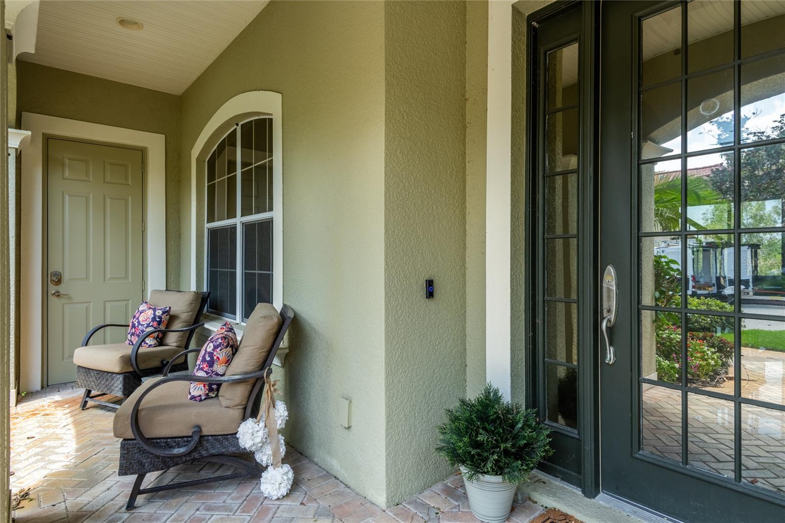 Covered entrance.  Door to left enters the garage.