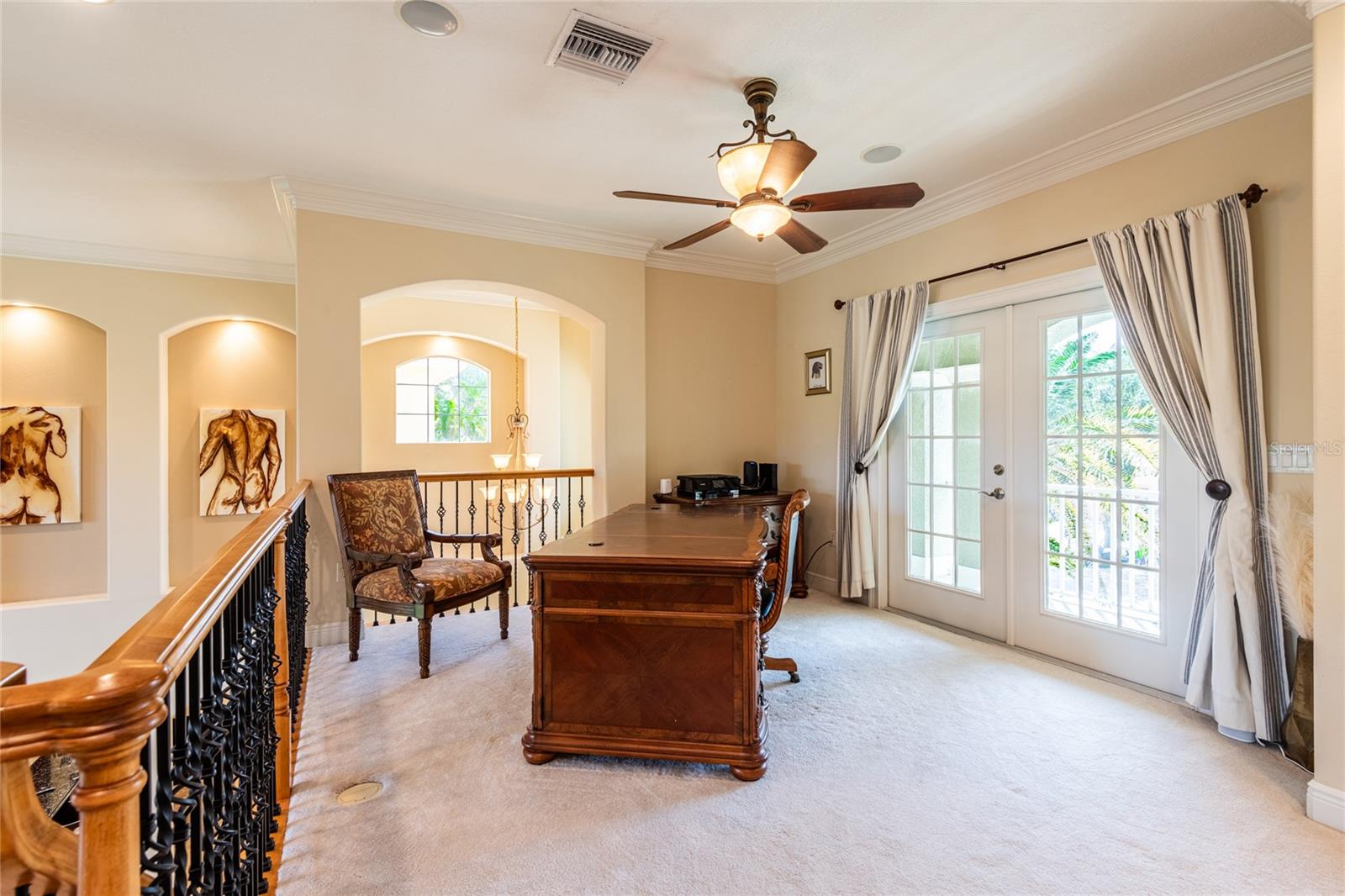 Office.  The elevator lift could be at the far back right side and just left of the French Doors.