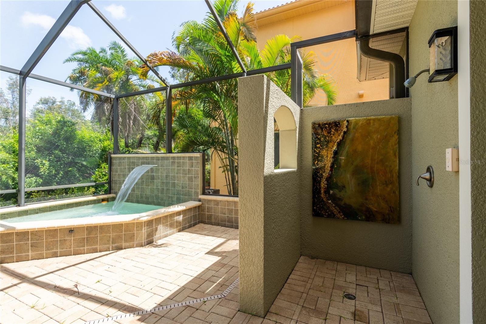 Entrance from the kitchen, living room and bar.  Outdoor shower.
