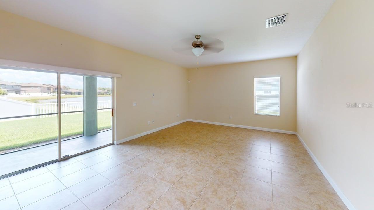 Family Room view from the kitchen with a view out to the yard