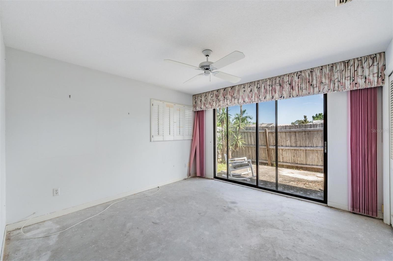 Primary Bedroom w/sliders to the back patio