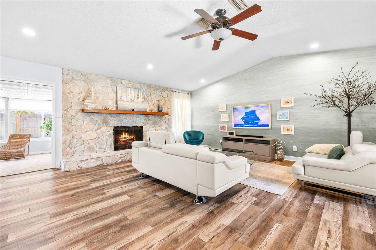 Furnished photos taken of living area before the property was vacant. Furniture and decorations do not convey.