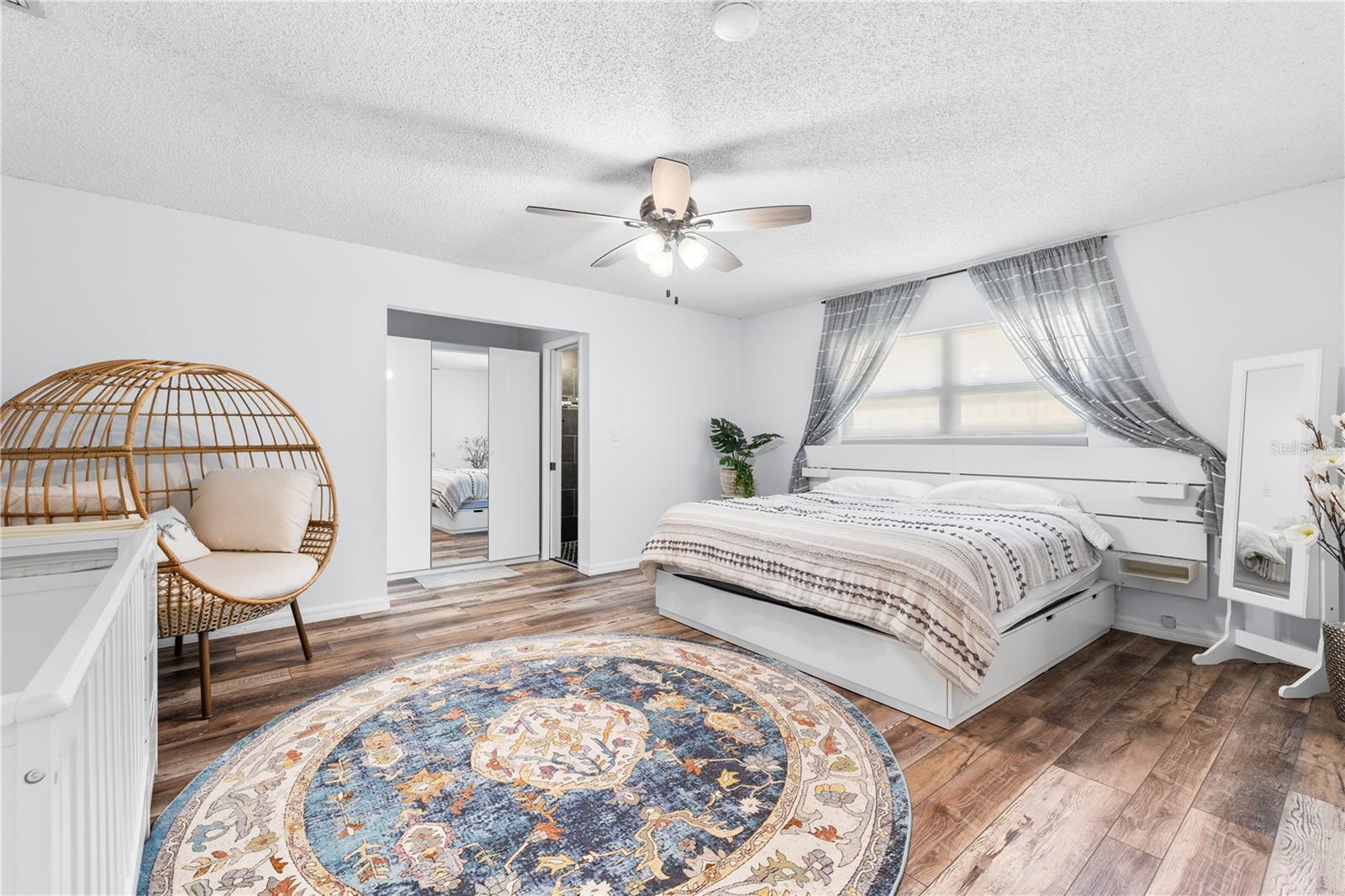 Furnished photos taken of Primary Bedroom before the property was vacant. Furniture and decorations do not convey.