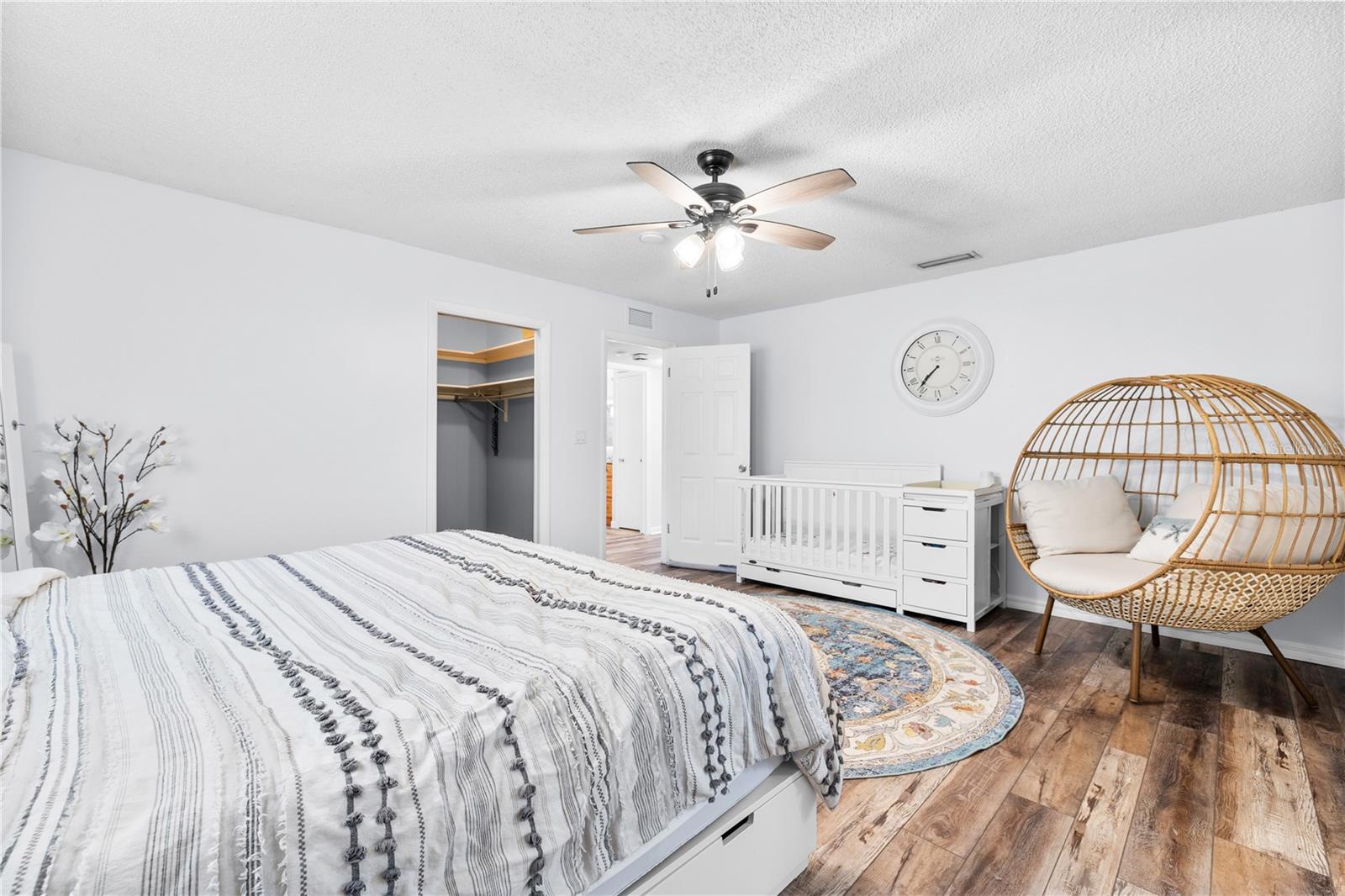 Furnished photos taken of primary bedroom before the property was vacant. Furniture and decorations do not convey.