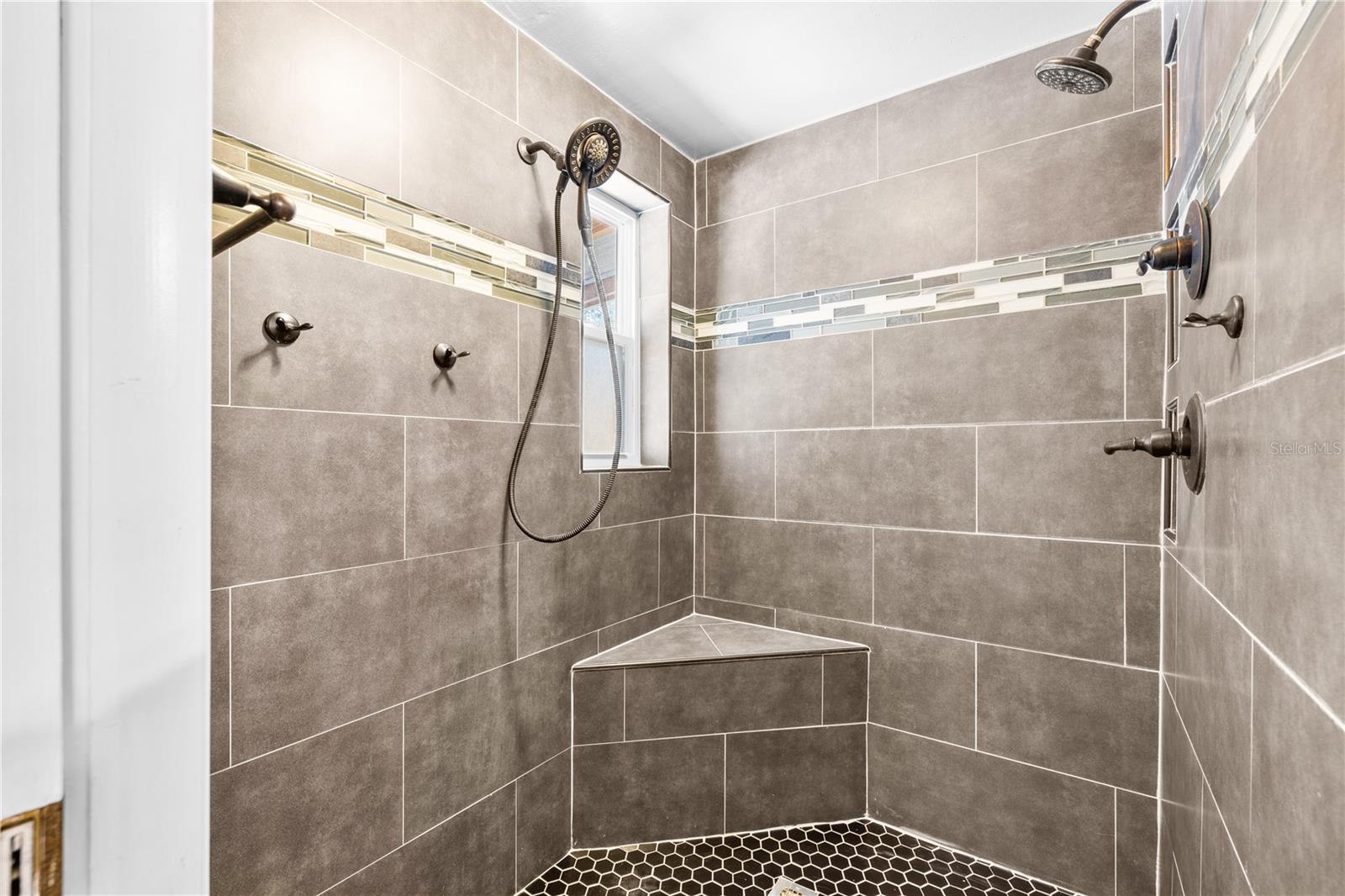 Furnished photos taken of primary bathroom before the property was vacant. Furniture and decorations do not convey.