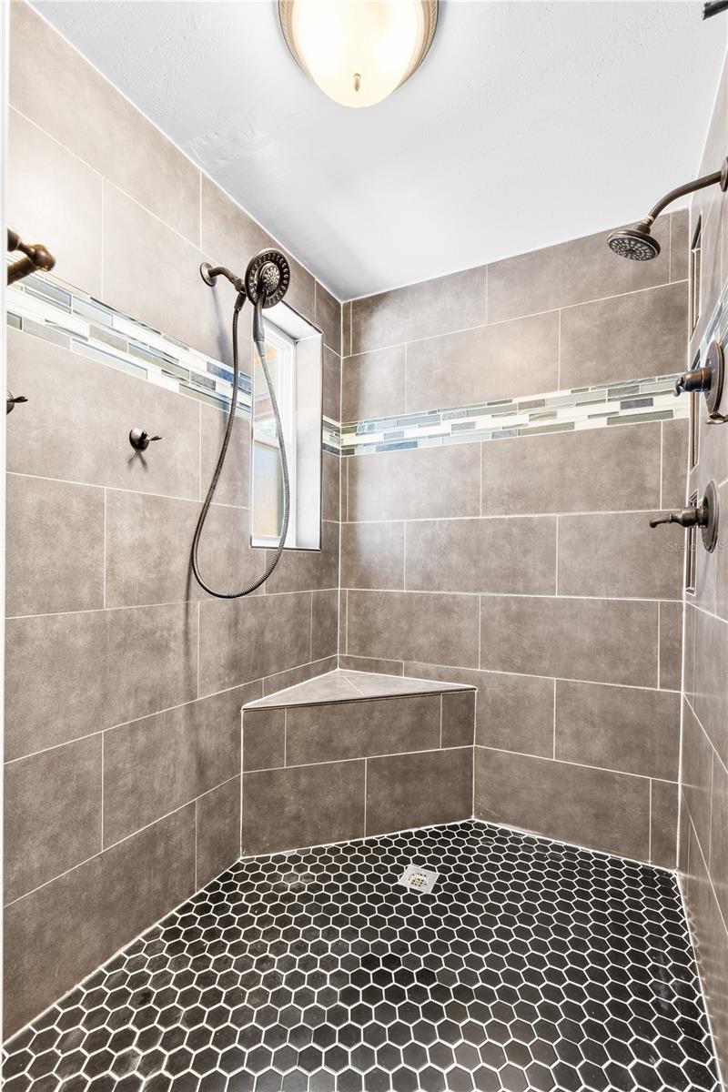 Furnished photos taken of primary bathroom before the property was vacant. Furniture and decorations do not convey.