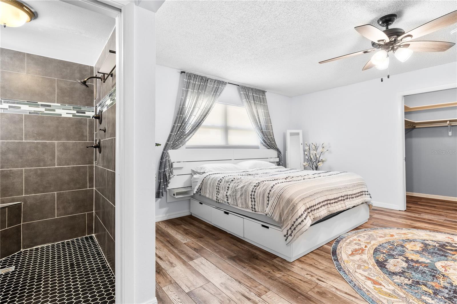 Furnished photos taken of primary bedoom, bedroom, and walk-in closet before the property was vacant. Furniture and decorations do not convey.