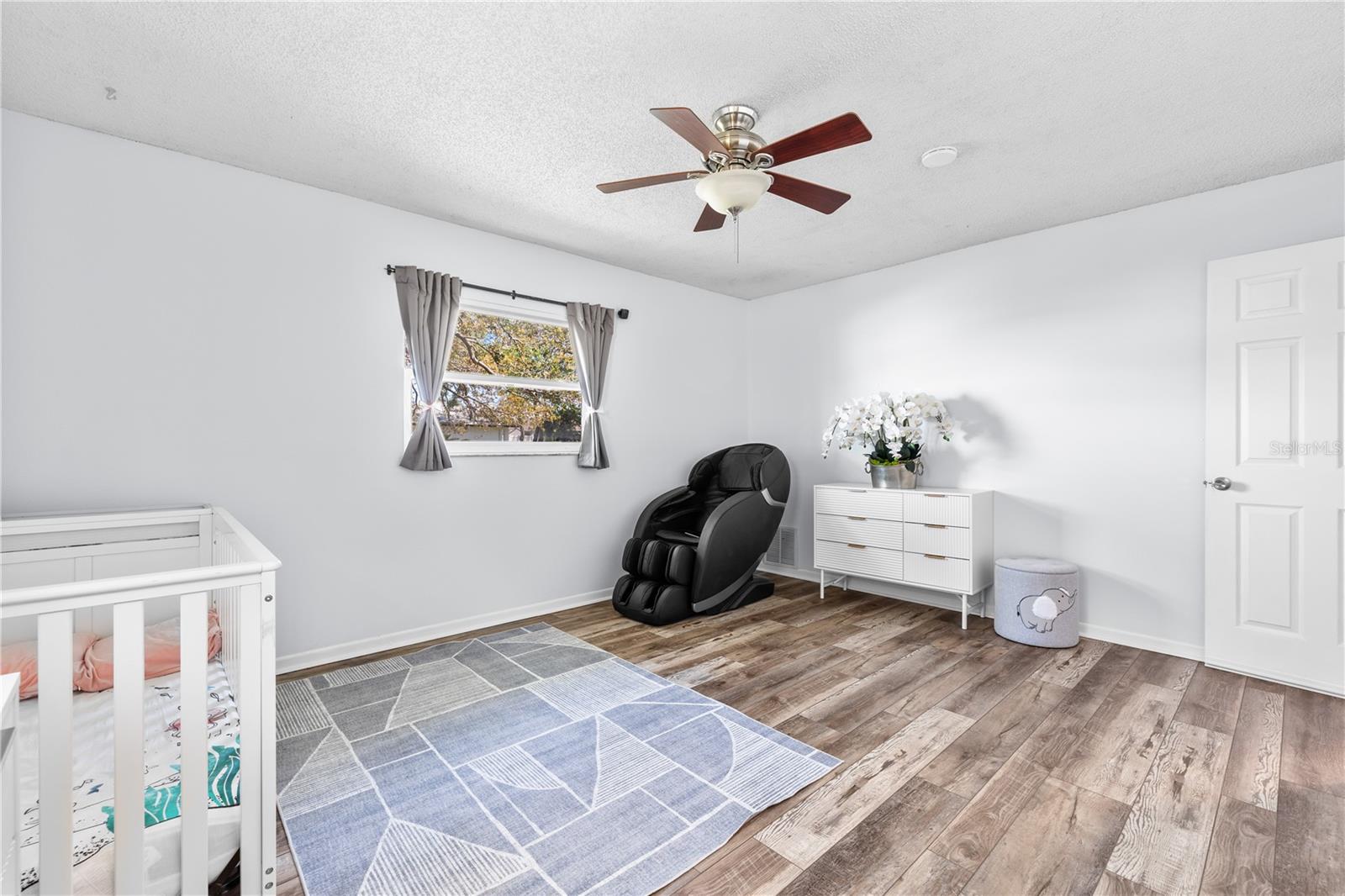Furnished photos taken of bedroom 2 before the property was vacant. Furniture and decorations do not convey.