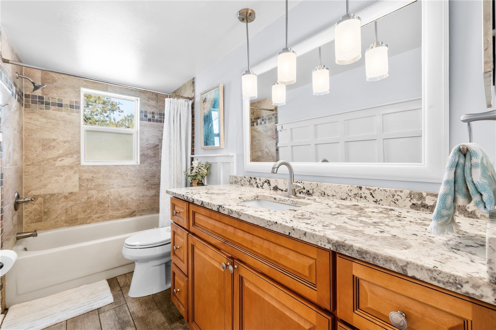 Furnished photos taken of bathroom 2 before the property was vacant. Furniture and decorations do not convey.