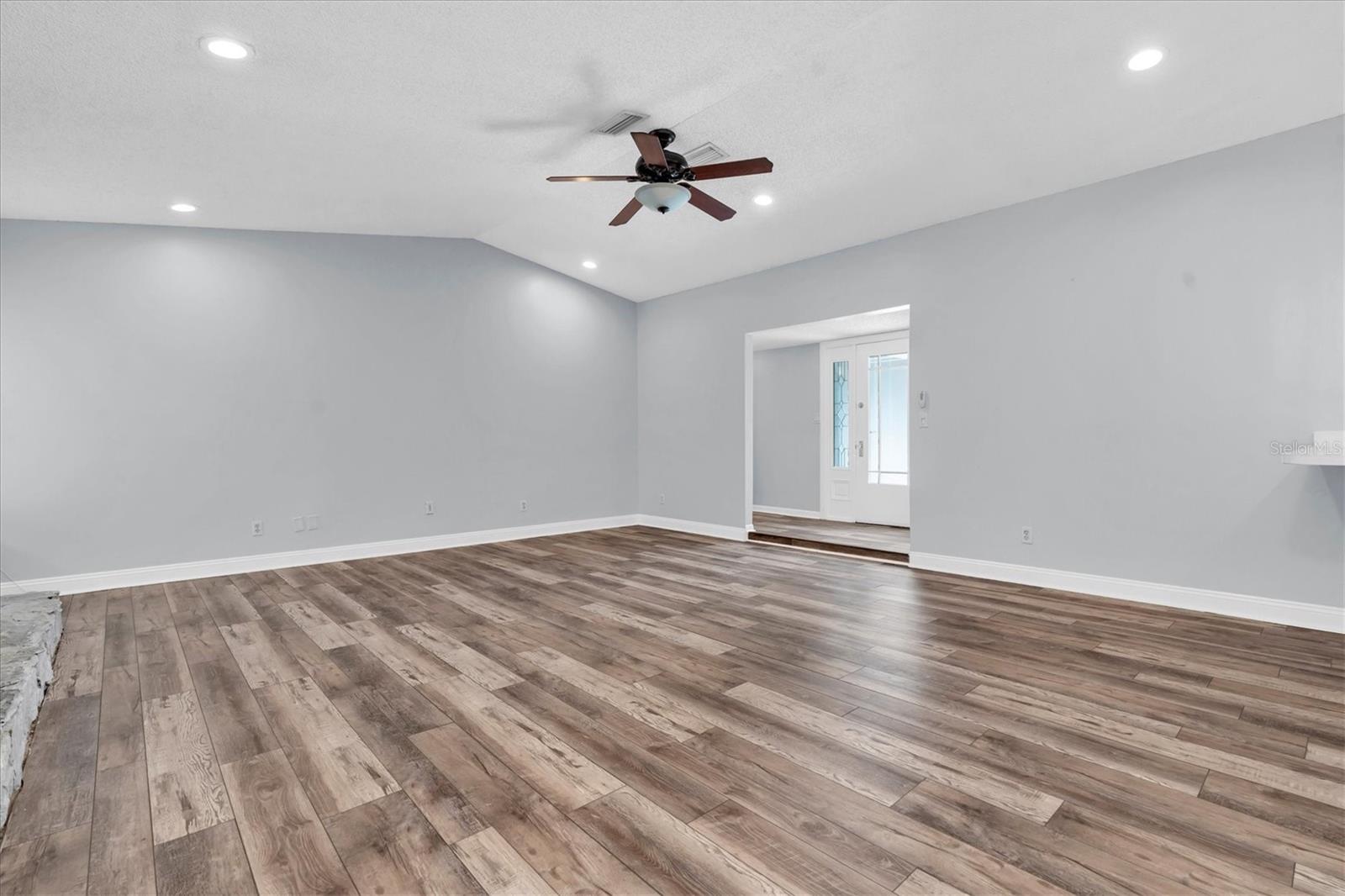 Unfurnished views of living area provided to showcase space and support your own decorating ideas.
