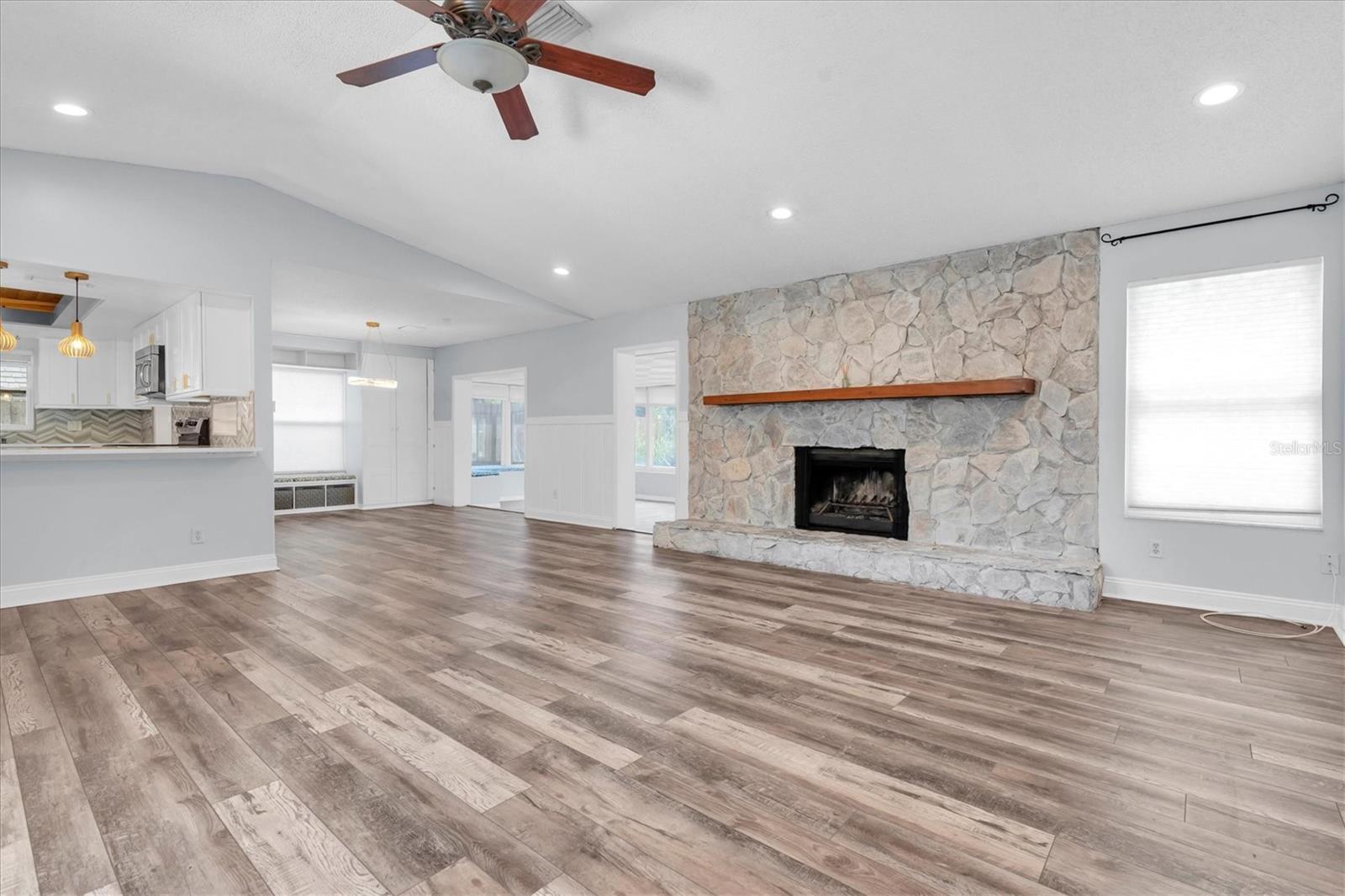 Unfurnished views of living and dining area provided to showcase space and support your own decorating ideas.