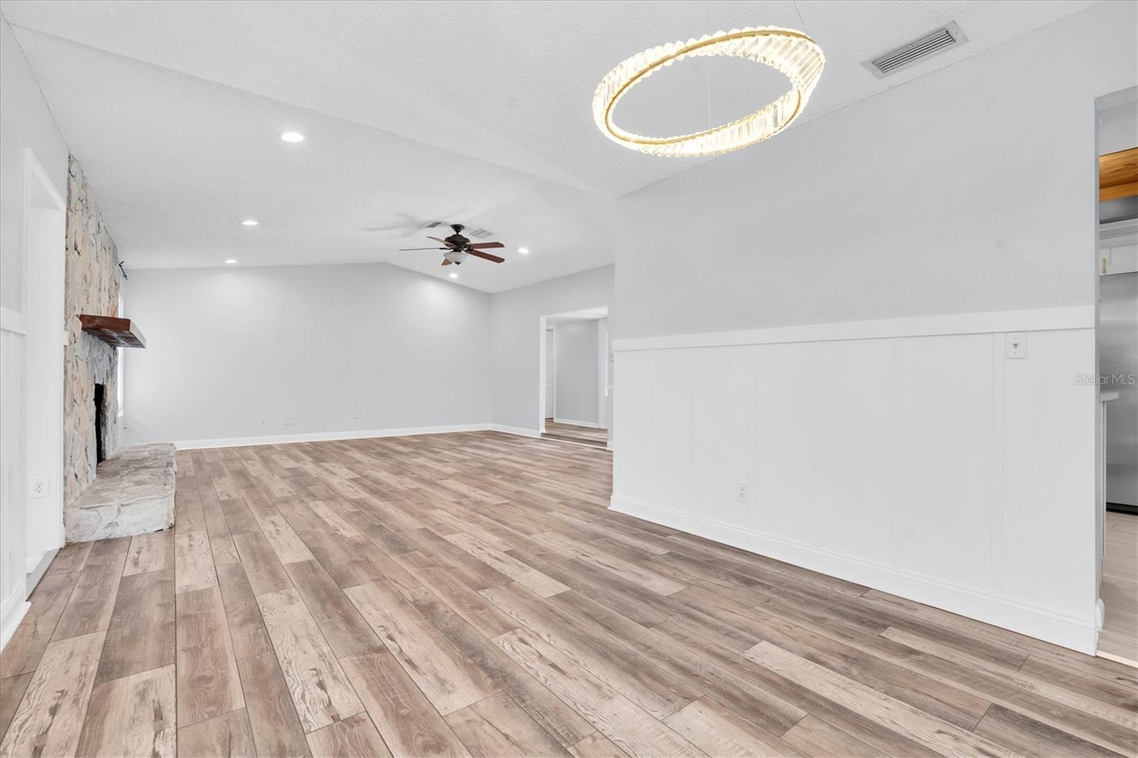Unfurnished views of dining and living area provided to showcase space and support your own decorating ideas.
