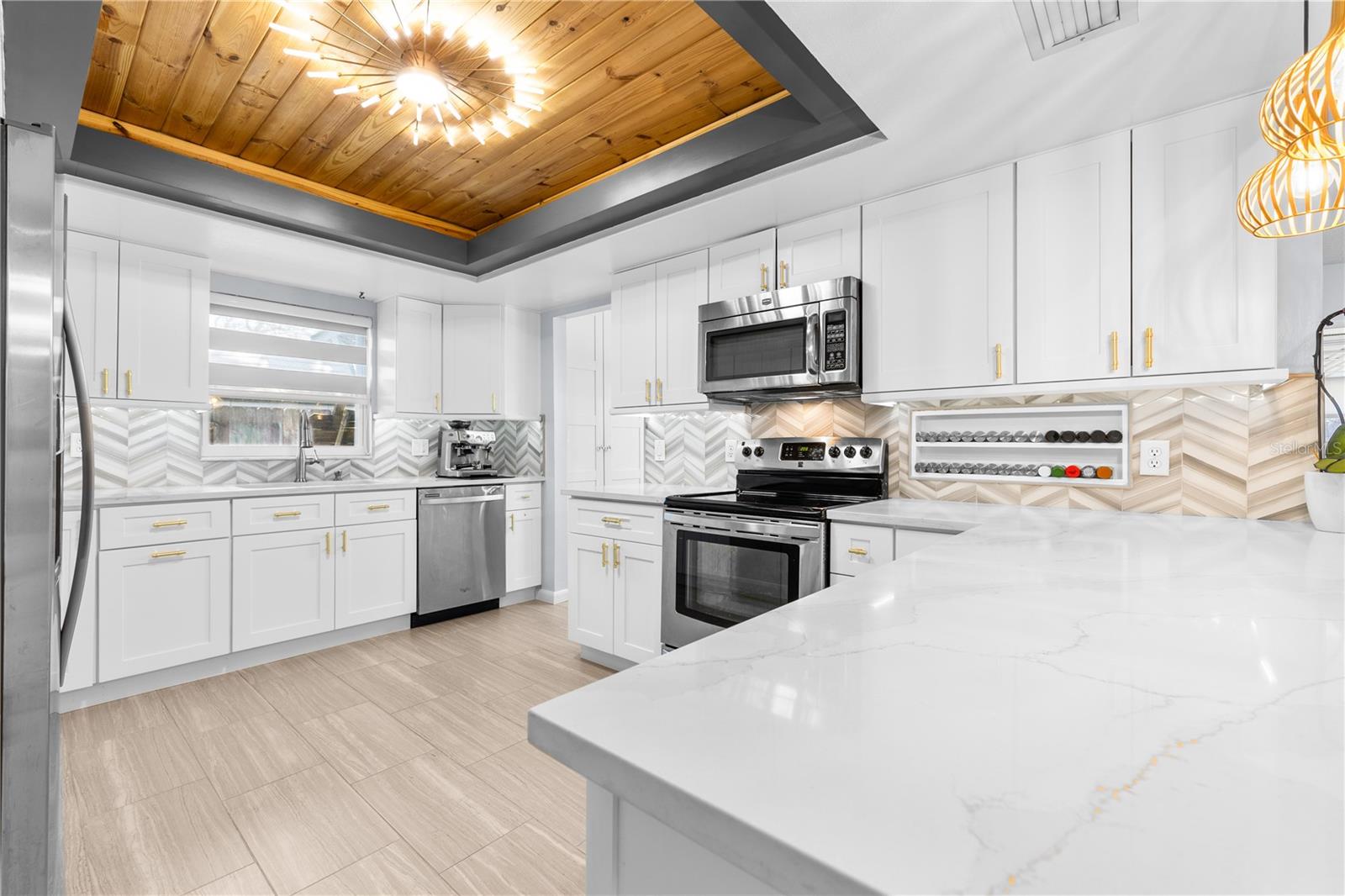 Furnished photos of kitchen taken before the property was vacant. Furniture and decorations do not convey.