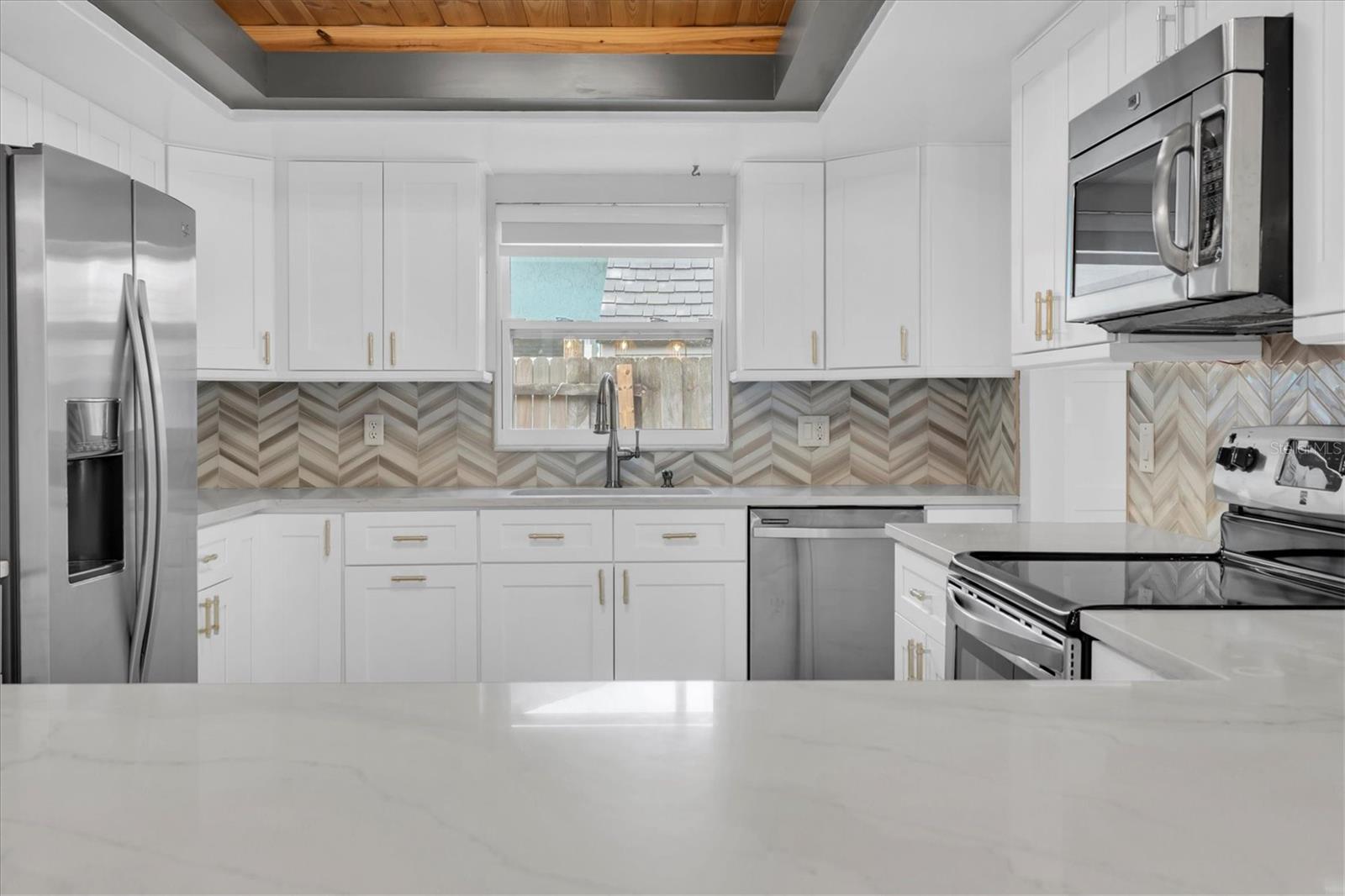 Unfurnished views of kitchen provided to showcase space and support your own decorating ideas.