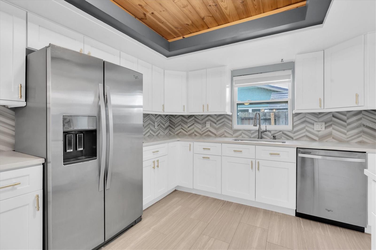 Unfurnished views of kitchen provided to showcase space and support your own decorating ideas.