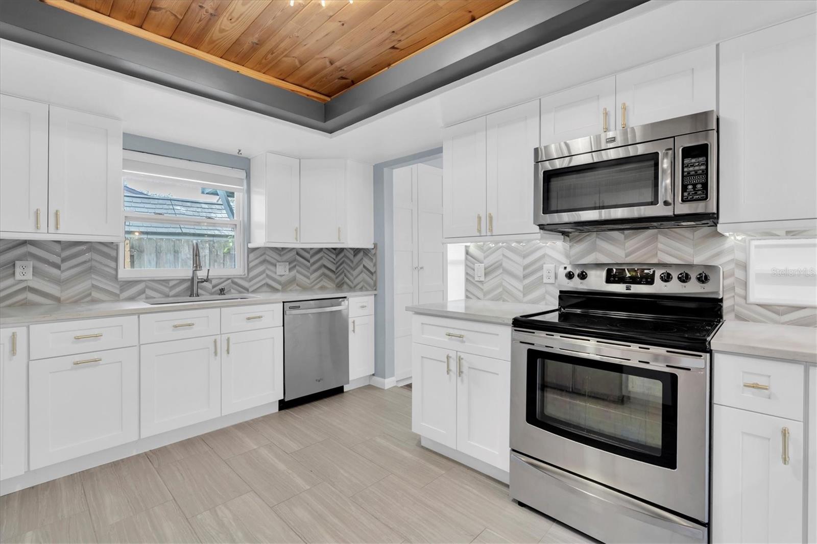 Unfurnished views of kitchen provided to showcase space and support your own decorating ideas.
