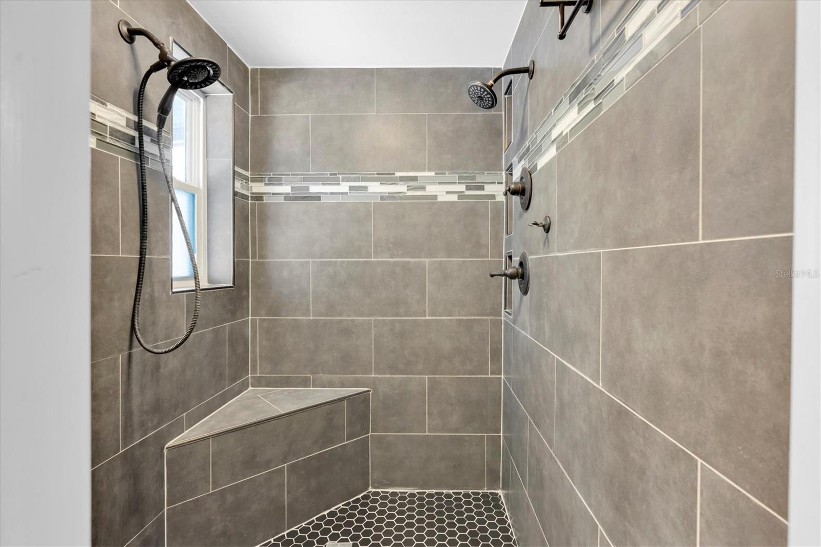 Unfurnished views of primary bathroom provided to showcase space and support your own decorating ideas.
