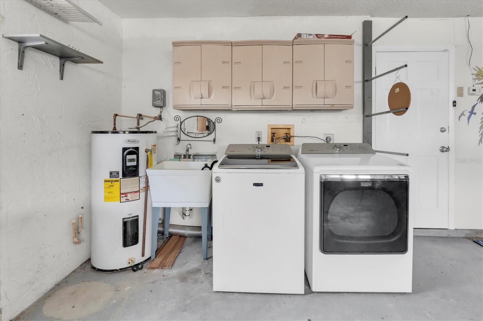 Water heater, washer and dryer.