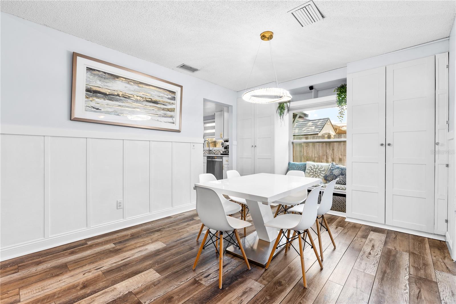 Furnished photos of dining area taken before the property was vacant. Furniture and decorations do not convey.