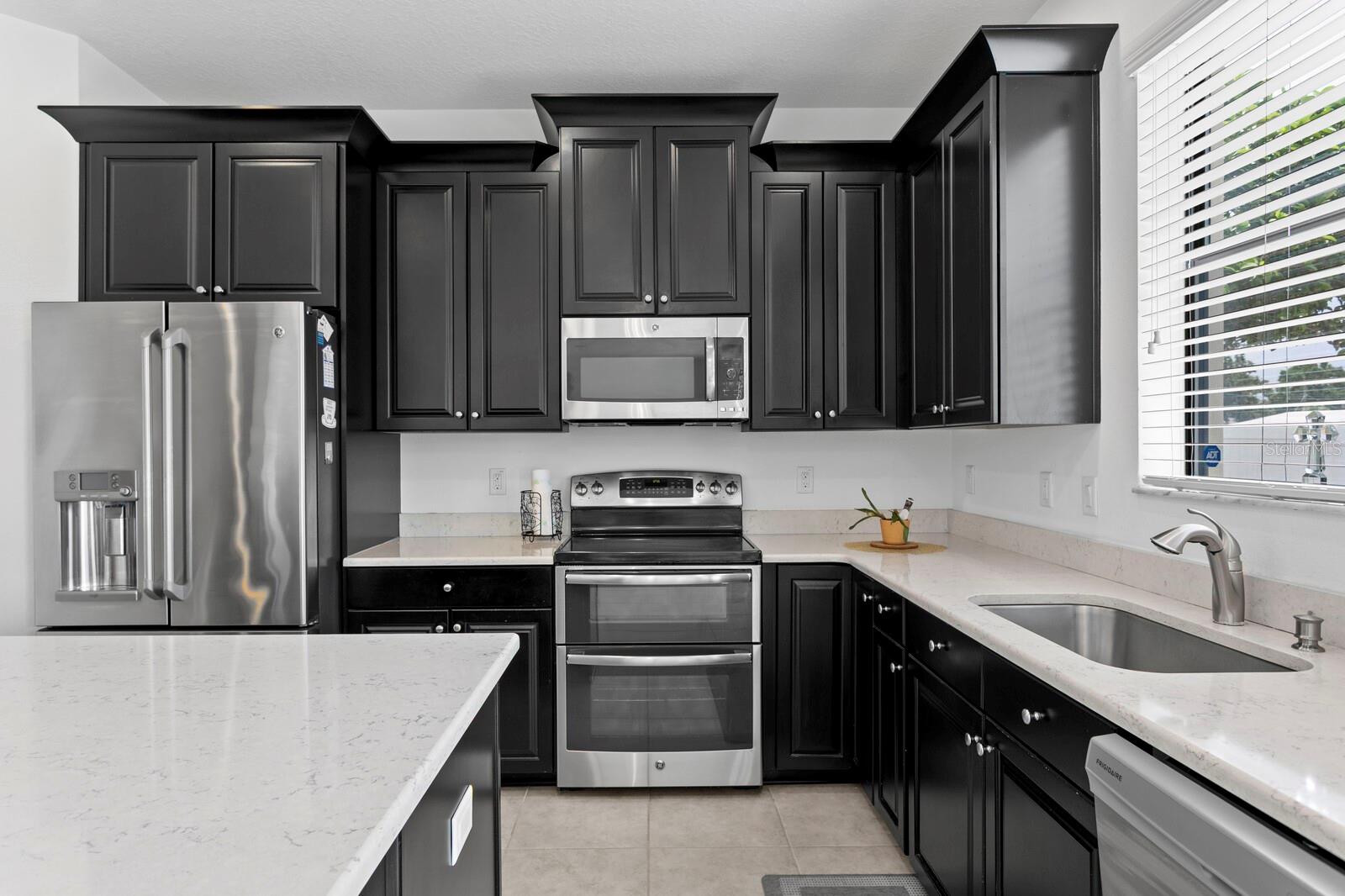Granite Countertops, wood cabs and double oven.